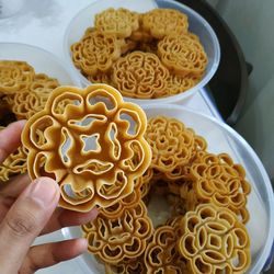 Close-up of hand holding noodles