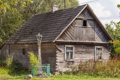 Exterior of old house on field