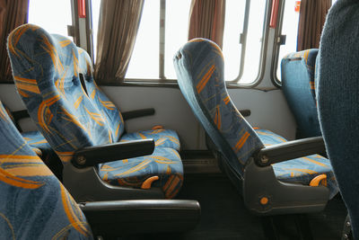 Low section of man sitting in bus