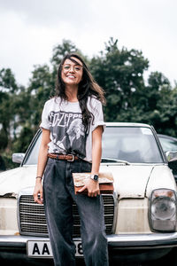 Portrait of a smiling young woman in car