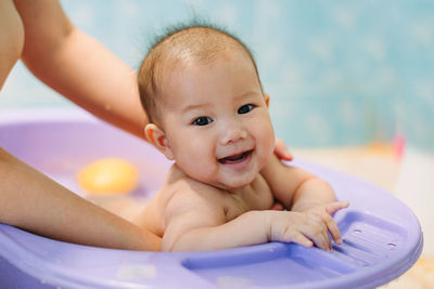 Portrait of cute baby girl in swimming pool