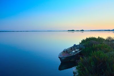 Scenic view of sea against clear blue sky