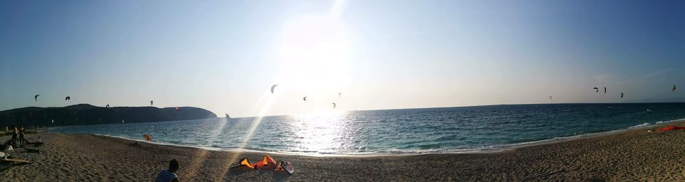 Scenic view of sea against clear sky on sunny day