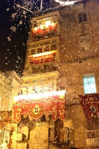 Low angle view of illuminated built structure