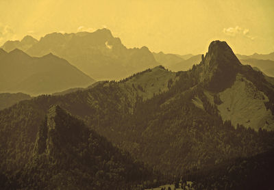 Scenic view of mountains against sky during sunset