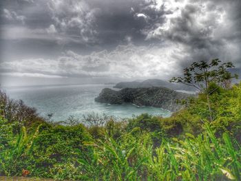 Scenic view of sea against cloudy sky