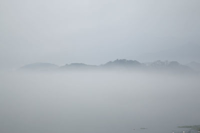 Scenic view of mountains during foggy weather