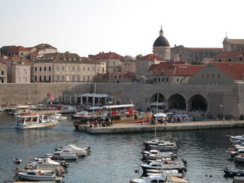 Boats in canal with buildings in background