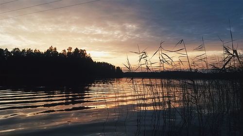 Scenic view of lake at sunset