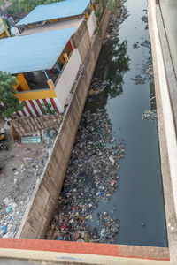 High angle view of swimming pool by lake