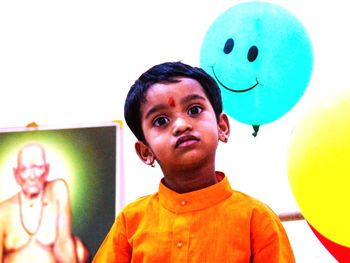 Portrait of happy boy with balloons