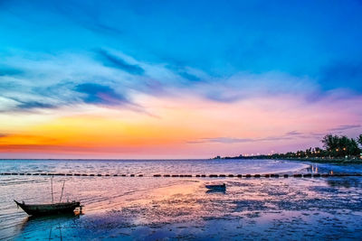 Scenic view of sea at sunset