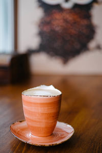 Close-up of coffee cup on table