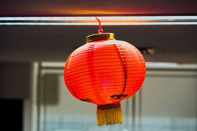 Close-up of illuminated lantern hanging on ceiling