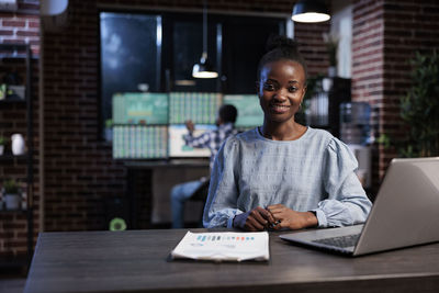 Smiling female professional in office