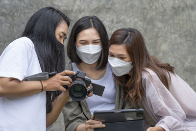Portrait of young woman wearing mask