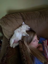 High angle view of woman sleeping on bed