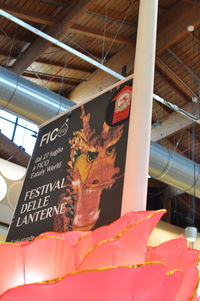 Low angle view of text on shelf