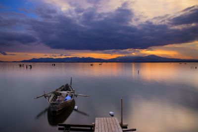 Scenic view of lake against sky during sunset