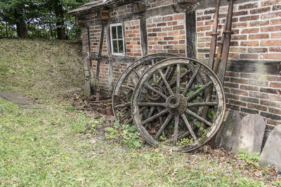 Old abandoned car on field