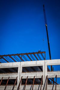Low angle view of built structure against blue sky
