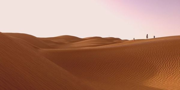 Scenic view of desert against clear sky