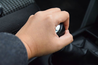Close-up of person holding camera