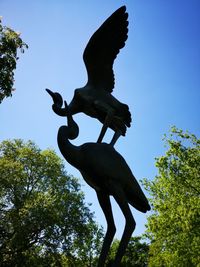 Low angle view of statue against sky