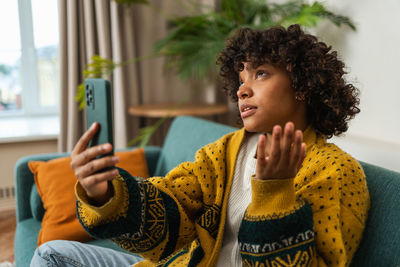 Young woman using mobile phone