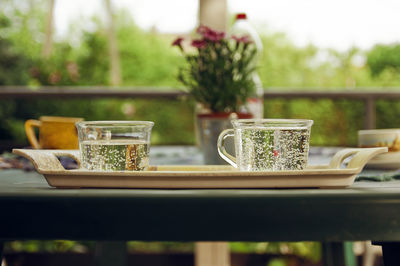 Cups in tray on table at yard