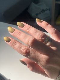 Close-up of hand holding coins