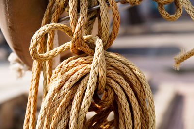 Close-up of rope tied on wooden post