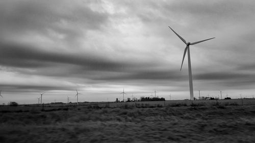Wind turbines in field