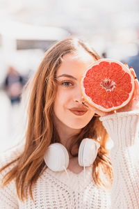 Portrait of woman with fruits