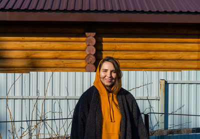 Portrait of smiling young man standing outdoors