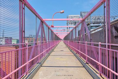 Footbridge against sky