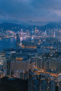 High angle view of illuminated buildings in city at night