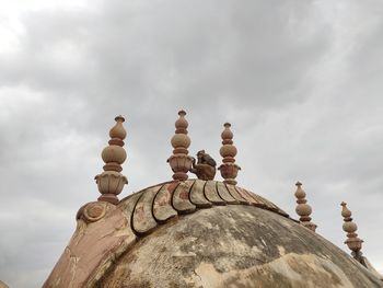 Low angle view of chess against the sky