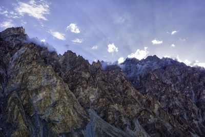 Low angle view of rocks against sky