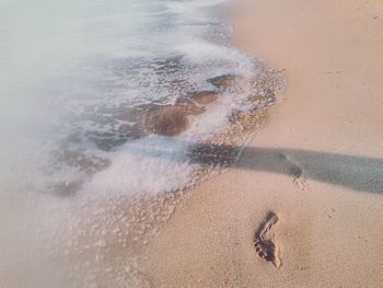 Wave on beach against sky