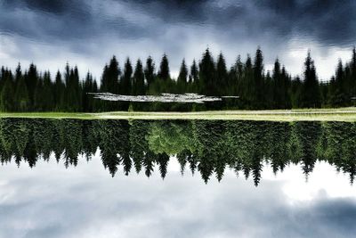 Scenic view of lake against cloudy sky