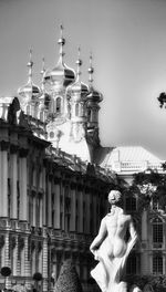 Low angle view of statue in front of building