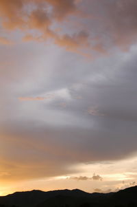 Scenic view of dramatic sky during sunset