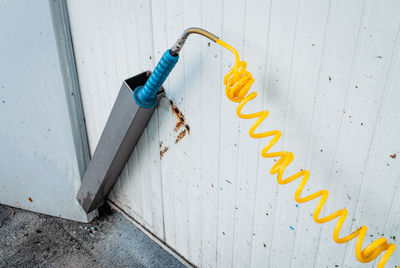 High angle view of yellow spiral of a water pump at a self service car wash 