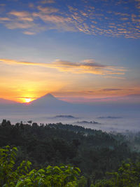 Scenic view of landscape against sky during sunset