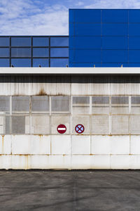 Industrial metal door with access prohibition signs