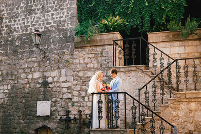 Young couple standing near railing