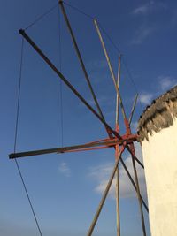 Low angle view of windmill against sky