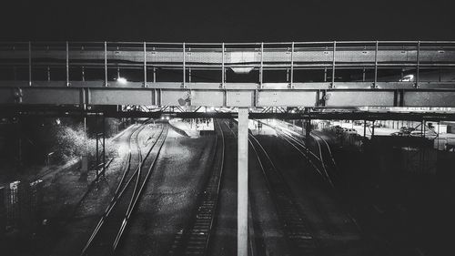 Train at railroad station against sky at night