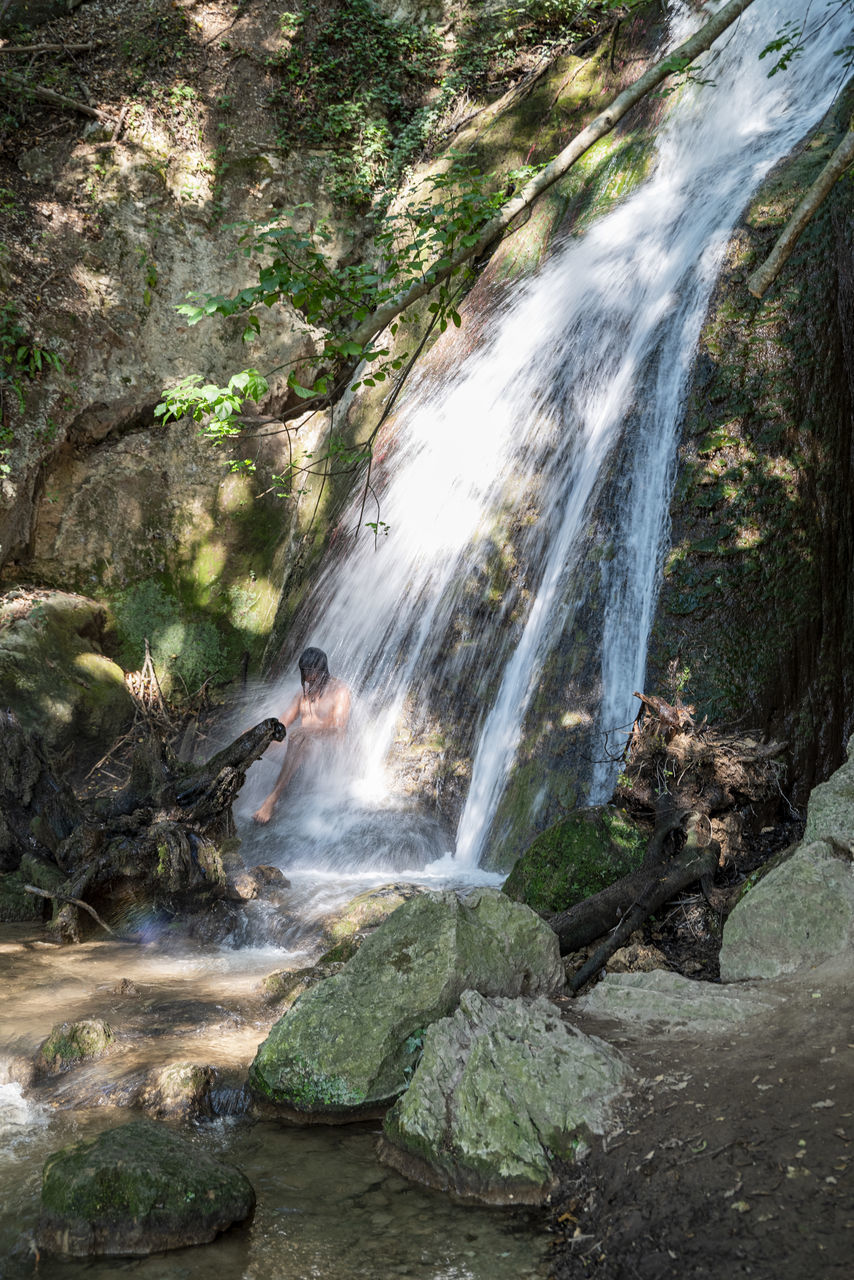 waterfall, water, beauty in nature, scenics - nature, body of water, nature, forest, land, motion, rock, tree, water feature, environment, plant, watercourse, stream, long exposure, spring, river, flowing water, non-urban scene, outdoors, water resources, travel destinations, sports, travel, blurred motion, jungle, flowing, rainforest, autumn, wilderness, landscape, rock formation, tourism, tranquil scene, day, adventure, moss, no people, holiday, trip, idyllic